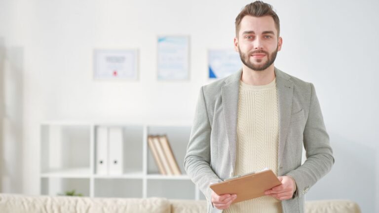 A confident male counselor standing and looking at the camera, representing professional support in an Intensive Outpatient Program in Colorado.