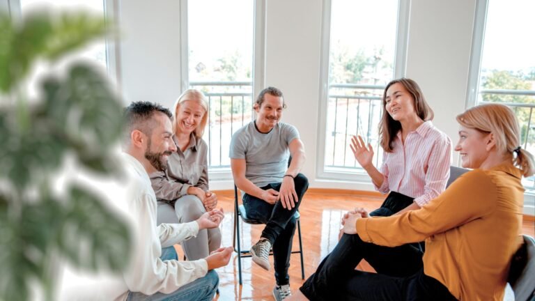 A supportive group therapy session in progress at an Intensive Outpatient Program in Colorado, with participants engaged in discussion and recovery.